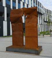 Rust-colored sculpture with two adjacent large rectangles