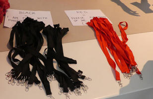 Red and black lanyards for conference badges