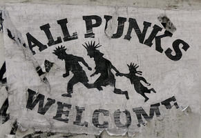 Silhouettes of family with mohawks. Text: All Punks Welcome