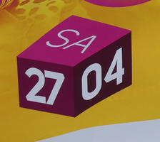 Cube with SA 27 04 showing on three faces