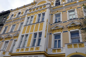 Building with yellow facade with figure 8 design