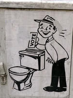 Sticker of man putting ballot into ballot box which is actually a toilet tank