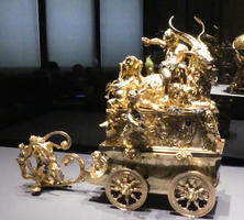 Gold carriage with cherub on top