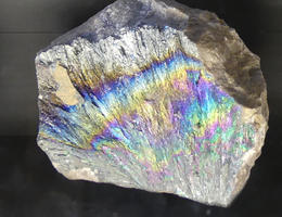 Mineral with iridescent streaks