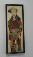 Portrait of seated woman wearing multicolored clothing
