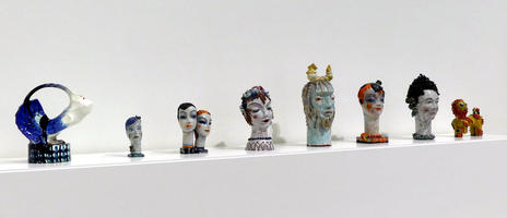 Row of small, somewhat abstract ceramc busts