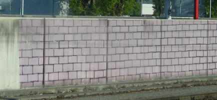 Concrete wall painted to look like a brick wall
