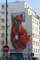 Five-story wall mural of fox sleeping curled up with head on pillow
