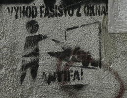 Stencil of man throwing another man out of window. Text: Throw fascists out the window! Antifa!