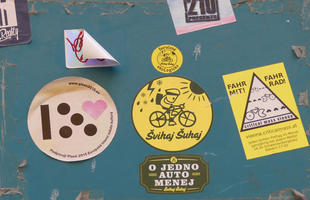 Variety of stickers, two apropos of bicycling