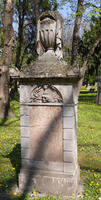 Gravestone with urn on top