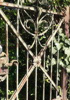 Wrought-iron gate with green patina