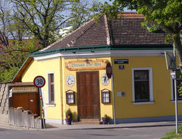 Restaurant with fraktur script on sign: Oberlaaer Dorf-Wirt