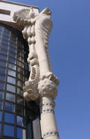 Multi-story column on building corner, shaped as an eagle at top