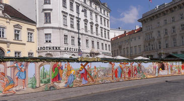 Easter scenes painted on wooden barrier