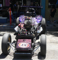 Race car with A&W decal on front and purple paint highights