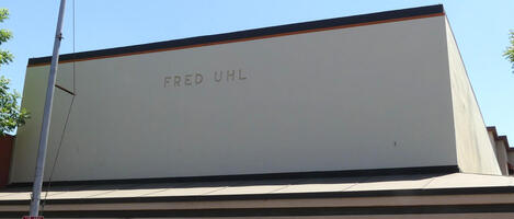 Building with name FRED UHL engraved on roof area