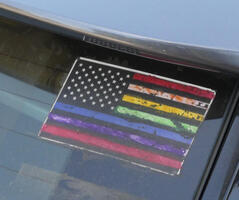 Flag decal with multi-colored stripes and white stars on black field