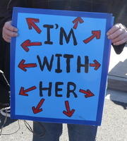 Arrows pointing in all directions surrounding text: I’m with her