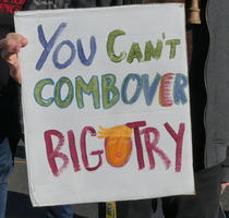 You can’t combover bigotry; the last “o” is a Trump face.