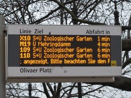 Sign showing bus line number, destination, and how long until it will leave that bus stop.