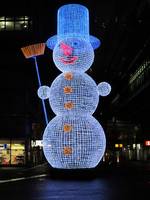 wire-frame blue snowman, about 10 meters tall