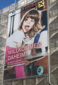 Ad for home loans from Raffeisen bank; features almost terrifyingly cute child with tongue sticking out