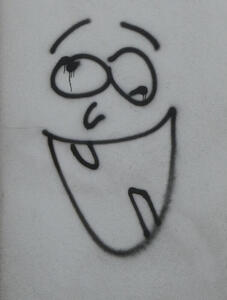 graffiti goofy looking person with two teeth