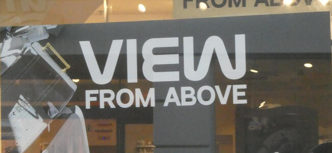 Sign: View from above, all in capital letters. Word “view” is in NASA font.