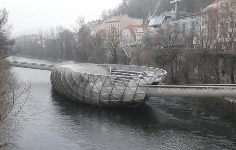 Mur island - a large metal platform between the two sides of the river, reachable by a ramp from either side.