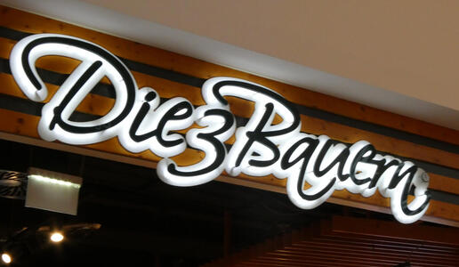 Neon sign: Die 3 Bauern (The Three Farmers)