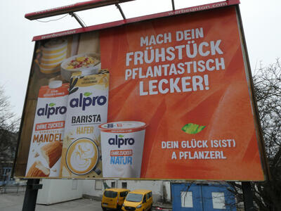 Billboard with pictures of plant-based milk and yogurt