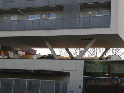 An apartment building on stilts.