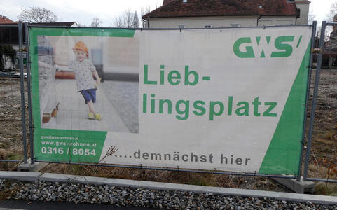 Sign at construction area with little girl in hard hat.  Lieblingsplatz...demnächts hier