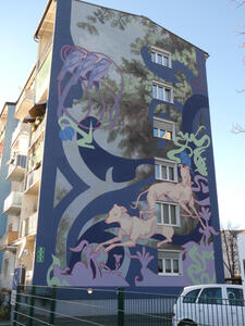 Painting on side of 5-story building; two greyhounds are depicted near the bottom