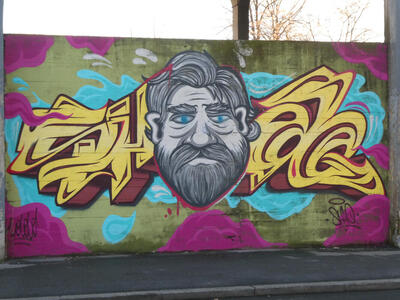 graffiti man with gray hair and beard