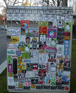 Utility box covered with neatly arranged stickers