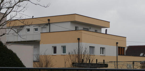 Apartment building with horizontal beige and white striping