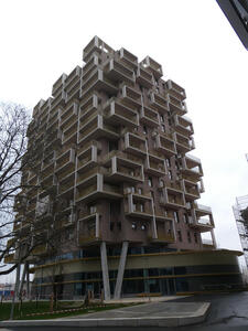 Apartment building with irregularly placed balconies outside apartments