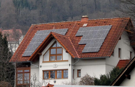 old style house with solar panels