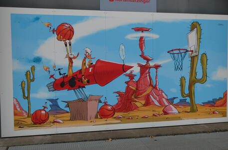 Wall painting of ducks on a rocket plaing basketball; drawn in the style of the Road Runner cartoons.