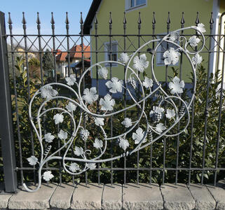 flowery metalwork on fence