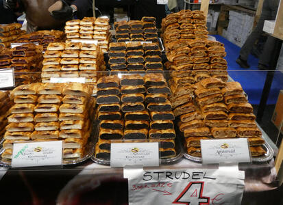 Trays of cherry, poppy seed, and apple strudel.