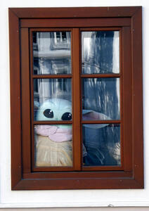 plush baby yoda in window