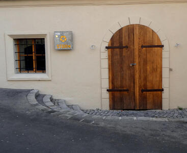 arched doorway with wooden doors