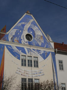 building with sky blue painting on roof