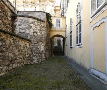 alleyway with stone wall