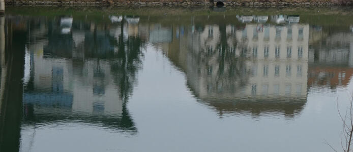 buildings reflected in water