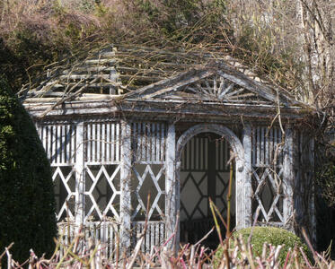 wooden building with thatched canopy