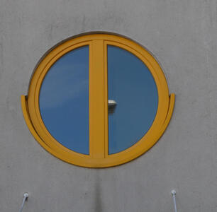 circular window with yelllow frame